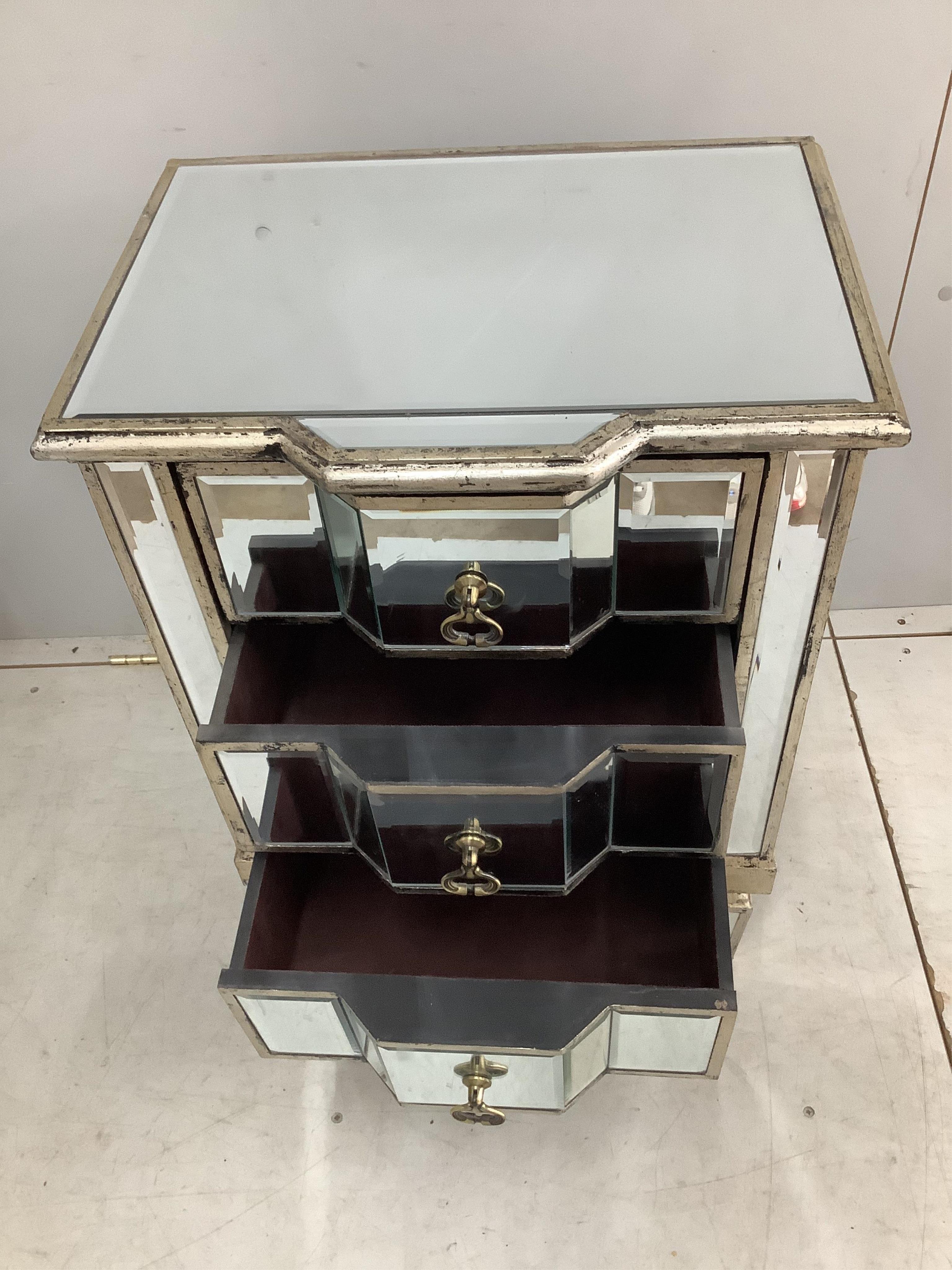 A pair of modern Venetian style mirrored three drawer bedside chests, width 47cm, height 72cm